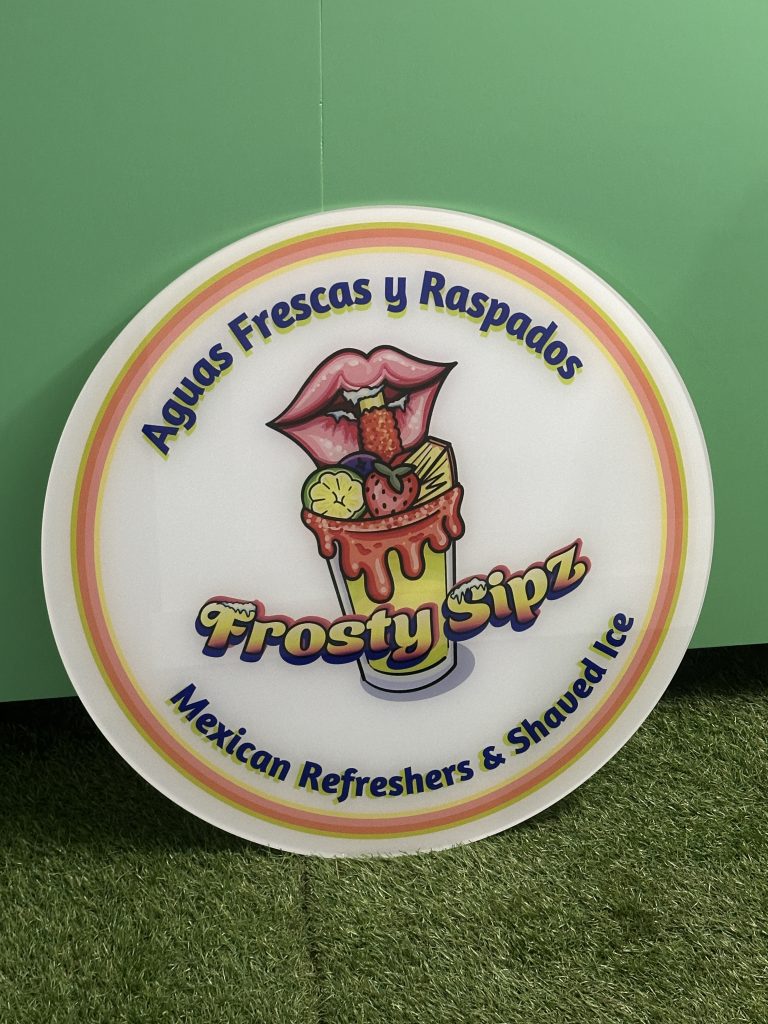 Colorful custom event sign for Frosty Sipz