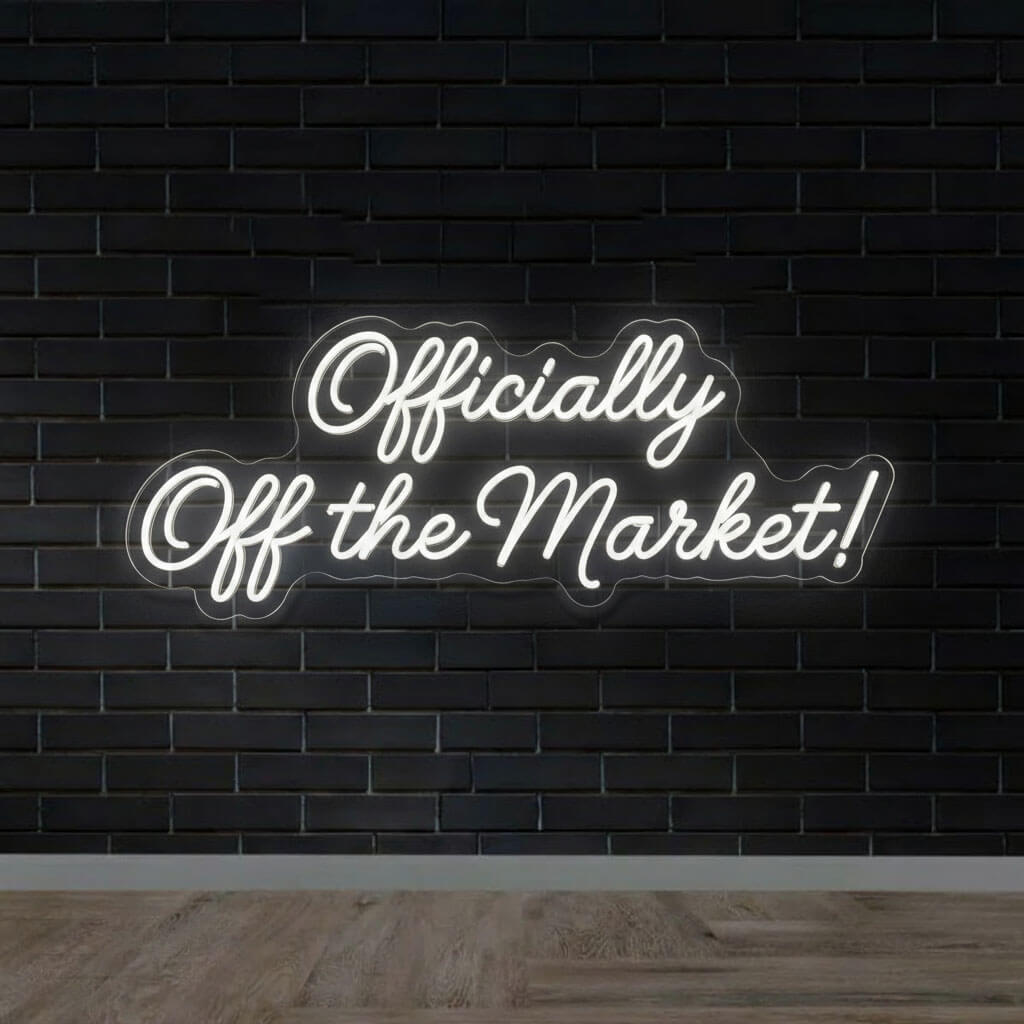 Officially Off the Market Funny Wedding Neon Sign shown in a room setting